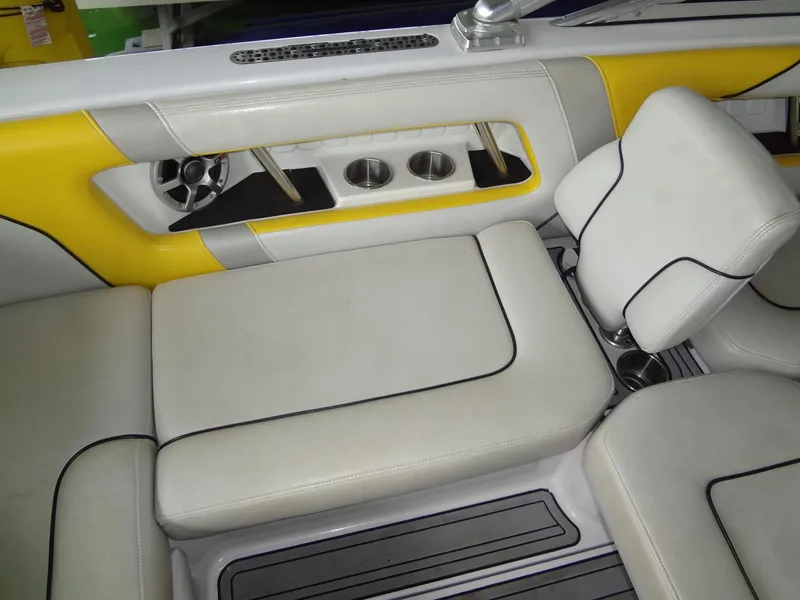 Slide: The Image of 2008 Correct Craft Super Air Nautique 230 boat with yellow and gray seating. - 17