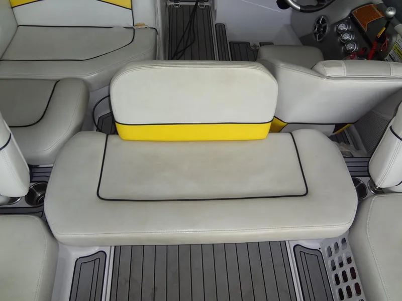 Slide: The Image of 2008 Correct Craft Super Air Nautique 230 boat interior with yellow and white seating. - 20