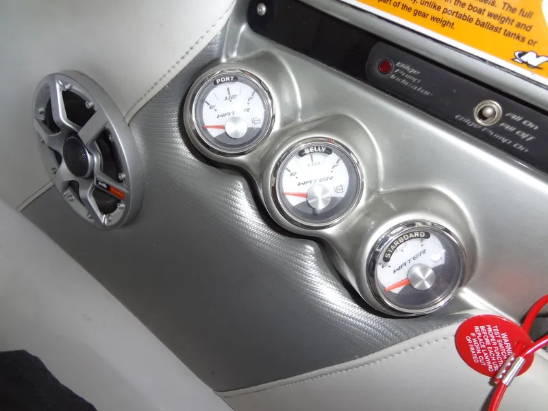 Slide: The Image of 2008 Correct Craft Super Air Nautique 230 interior with yellow and gray seating. - 26