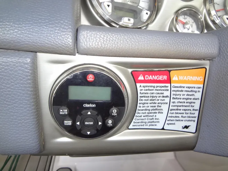 Slide: The Image of 2008 Correct Craft Super Air Nautique 230 interior with white and yellow seating. - 27