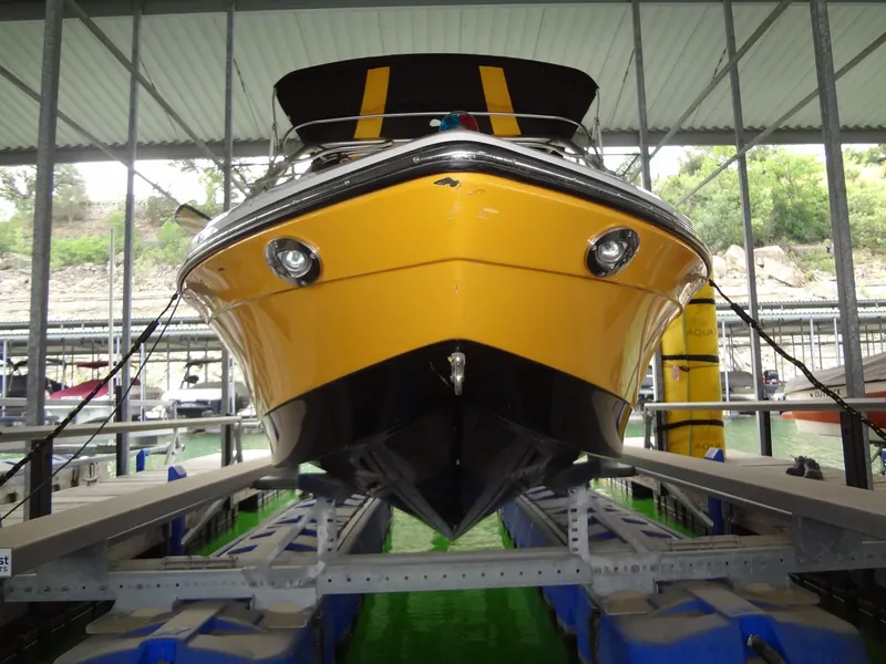 Slide: The Image of 2008 Correct Craft Super Air Nautique 230 boat on trailer, yellow and black design. - 3