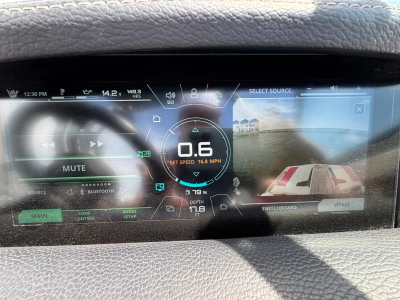 Slide: The Image of Dashboard of 2018 Nautique Super Air Nautique 210 boat, displaying speed and settings. - 24