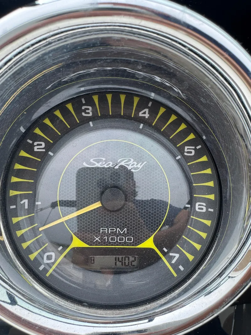Slide: The Image of Close-up of a 2019 Sea Ray SPX 230 RPM gauge displaying 1402 RPM. - 23
