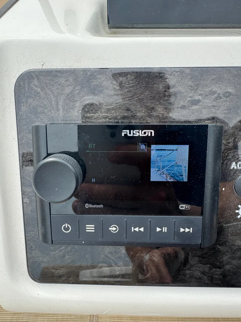 Slide: The Image of Fusion audio system on 2019 Sea Ray SPX 230 boat dashboard. - 24