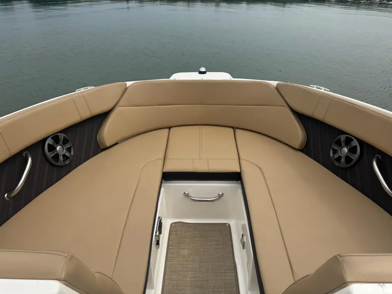 Slide: The Image of 2019 Sea Ray SPX 230 boat interior with tan seating and stainless steel accents. - 5