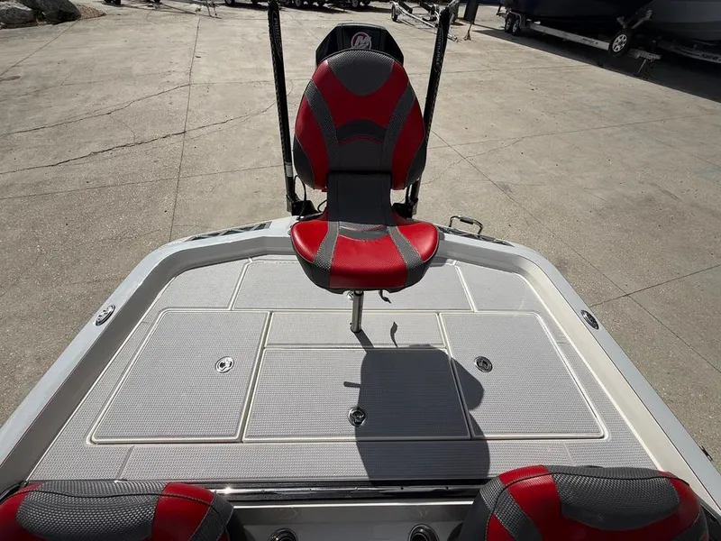 Slide: The Image of 2021 Ranger Z521L Intracoastal boat with red and gray seating on a sunny day. - 10
