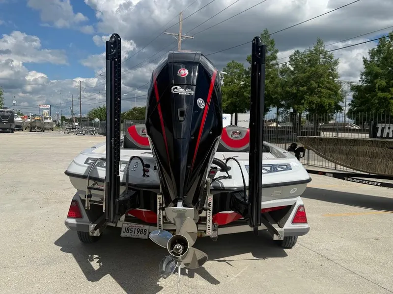 Slide: The Image of 2021 Ranger Z521L Intracoastal boat with powerful outboard motor, parked outdoors. - 3