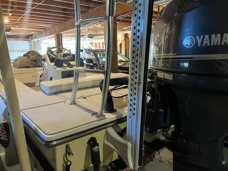 Slide: The Image of 2013 Beavertail 18 STRIKE boat with Yamaha engine in a garage setting. - 3