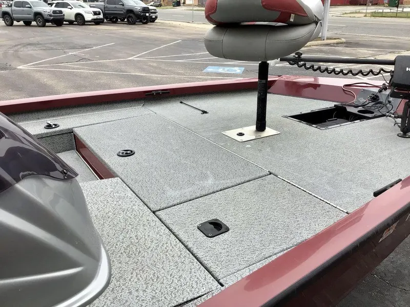 Slide: The Image of 2020 G3 1710 SPORTSMAN boat deck with seating and storage compartments in a parking lot. - 24