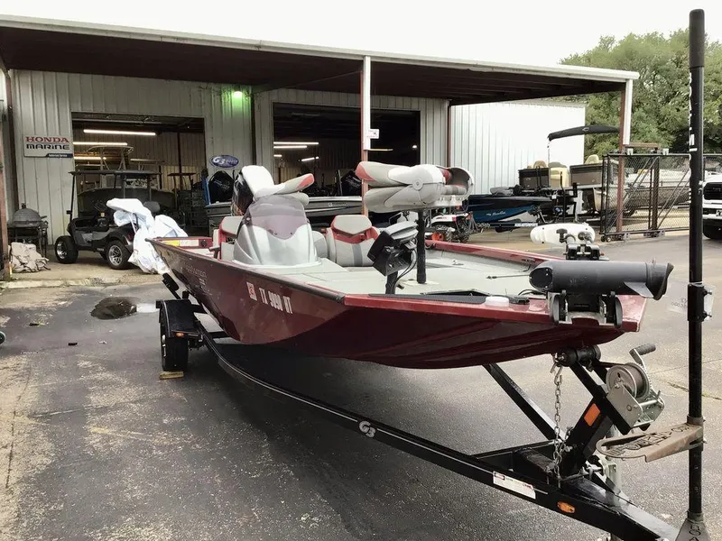 Slide: The Image of 2020 G3 1710 SPORTSMAN boat on trailer outside a marine service shop. - 5