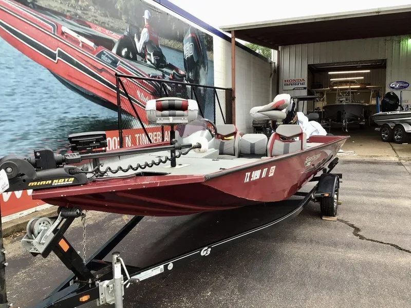 Slide: The Image of 2020 G3 1710 Sportsman boat on trailer, parked outside a marine shop. - 7