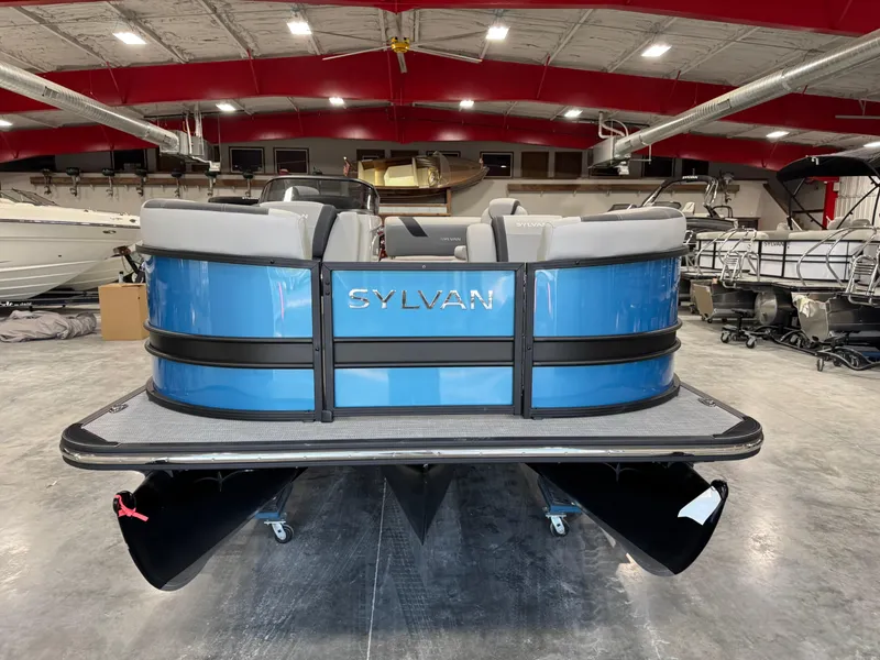 Slide: The Image of 2025 Sylvan L5 CLZ DH pontoon boat in showroom, rear view. - 10