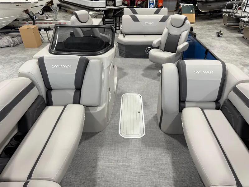 Slide: The Image of 2025 Sylvan L5 CLZ DH pontoon boat interior with luxurious seating and modern design. - 14