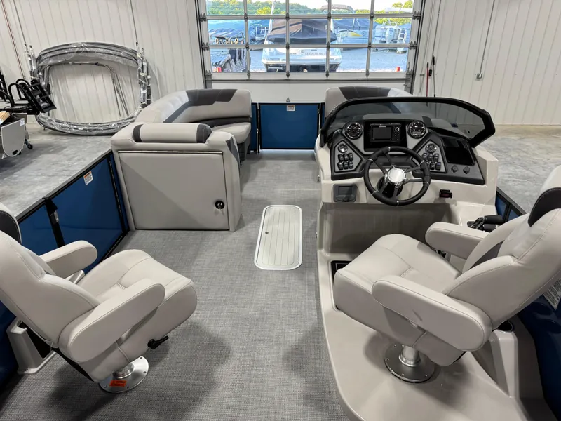 Slide: The Image of Interior of 2025 Sylvan L5 CLZ DH boat with modern seating and control panel. - 16