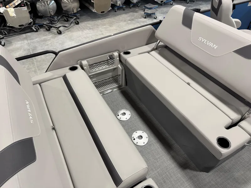 Slide: The Image of 2025 Sylvan L5 CLZ DH boat interior with gray seating and cup holders. - 17