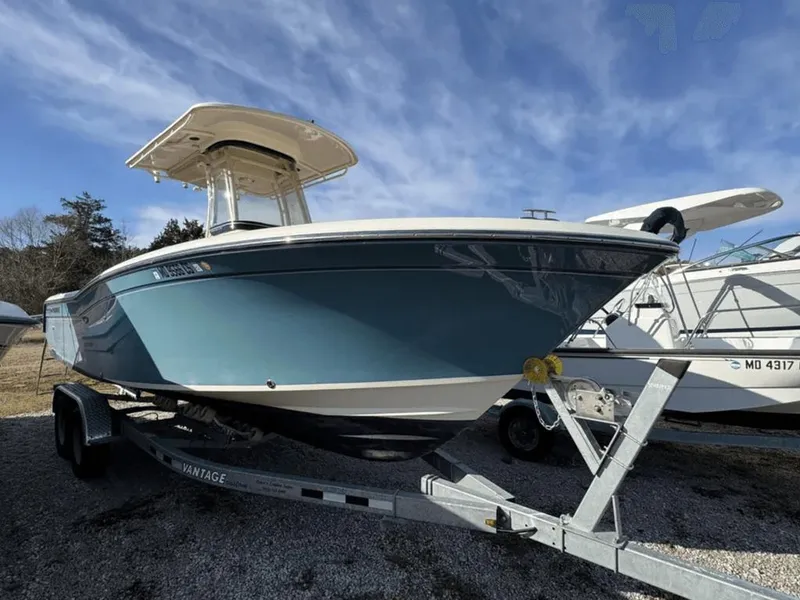 Slide: The Image of 2018 Grady-White Fisherman 236 boat on trailer under blue sky. - 0