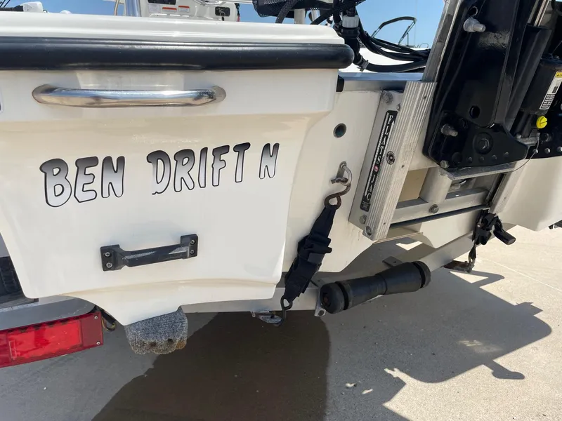Slide: The Image of 2013 Mako 18lts boat with "Ben Drift N" name on the stern. - 10