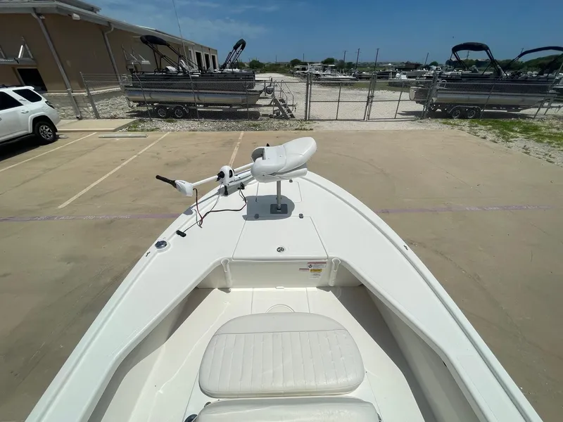 Slide: The Image of 2013 Mako 18lts boat with trolling motor in a parking lot. - 11