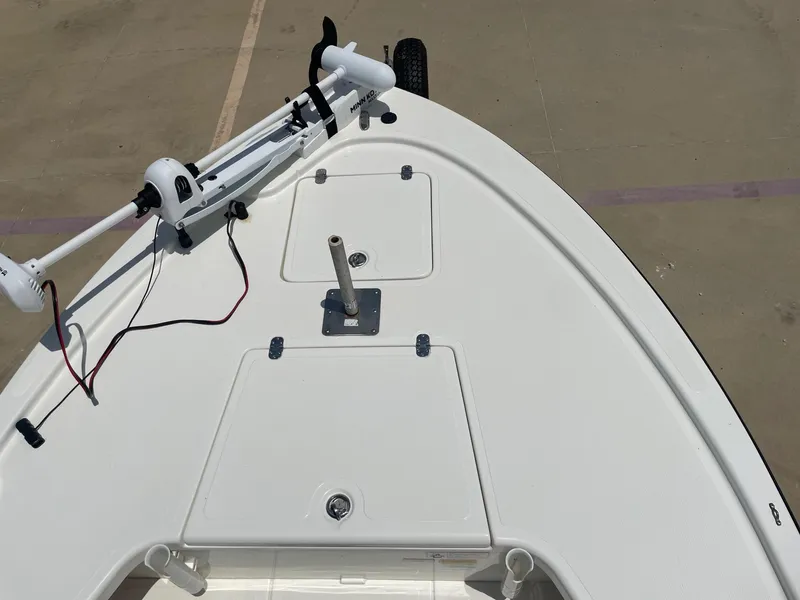 Slide: The Image of Bow of a 2013 Mako 18lts boat with trolling motor and storage compartments. - 14