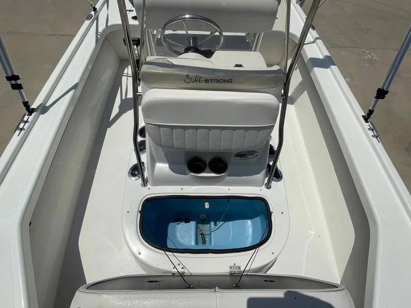 Slide: The Image of 2013 Mako 18LTS boat interior with steering wheel and seating. - 17