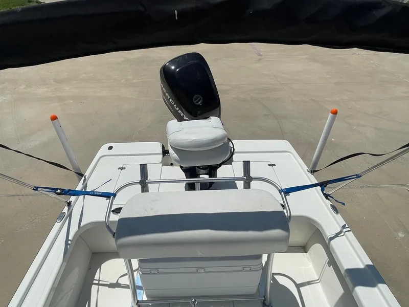 Slide: The Image of 2013 Mako 18lts boat with Mercury outboard motor, viewed from the rear deck. - 25