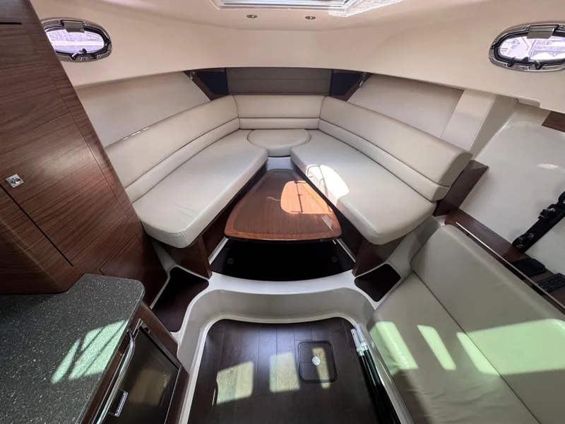 Slide: The Image of Luxurious interior of 2015 Boston Whaler 345 Conquest with elegant seating and wooden accents. - 10