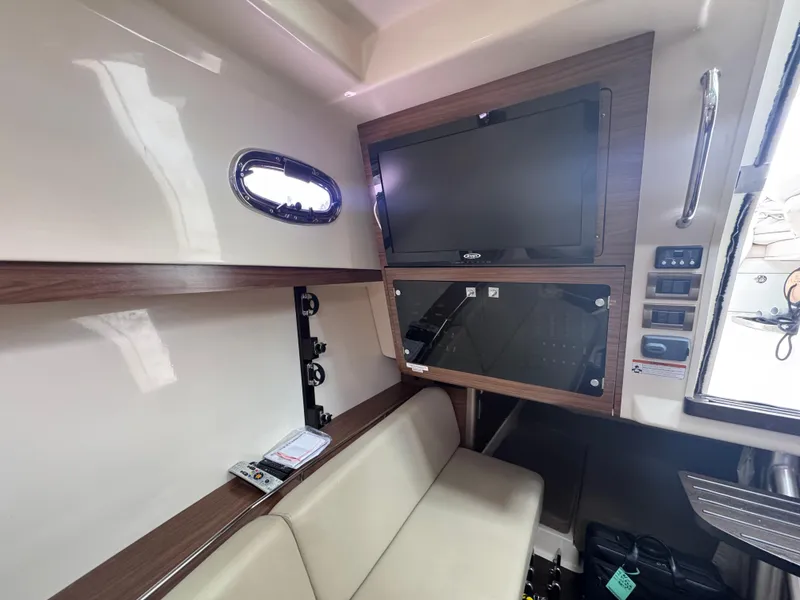 Slide: The Image of Interior of 2015 Boston Whaler 345 Conquest with TV and seating area. - 13