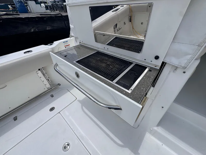 Slide: The Image of Outdoor grill on 2015 Boston Whaler 345 Conquest boat, featuring sleek design and stainless steel finish. - 22