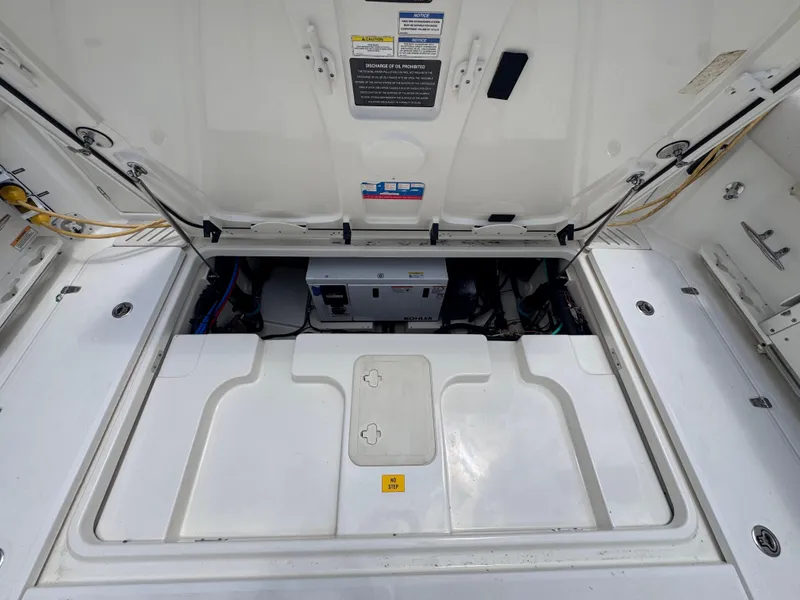 Slide: The Image of 2015 Boston Whaler 345 Conquest engine compartment, open hatch view. - 28