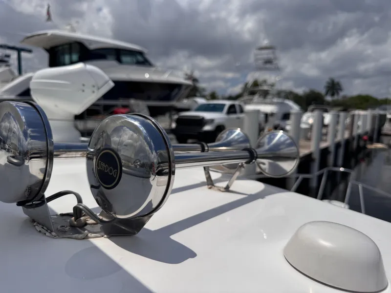 Slide: The Image of 2015 Boston Whaler 345 Conquest boat horn with marina background. - 33
