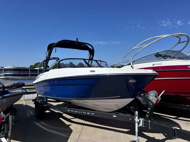 Slide: The Image of 2023 Bayliner VR4 Bowrider cruising on water with passengers enjoying the ride. - 1