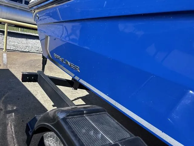 Slide: The Image of 2023 Bayliner VR4 Bowrider in vibrant blue on a trailer. - 3