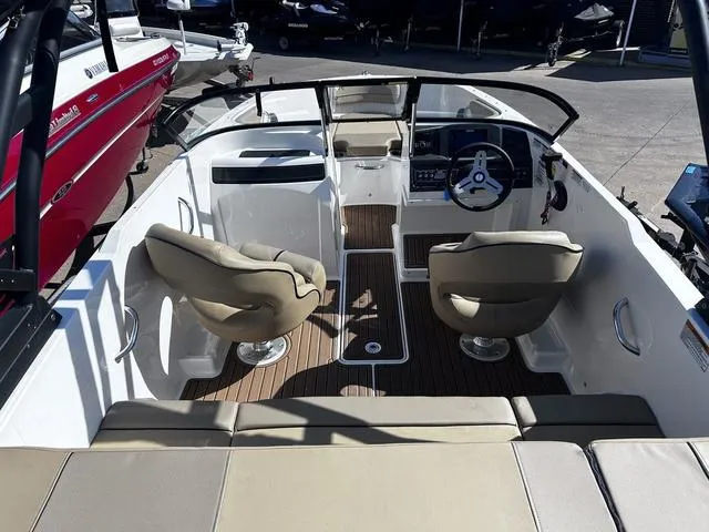 Slide: The Image of 2023 Bayliner VR4 Bowrider interior with seating and steering wheel, showcasing modern design. - 5