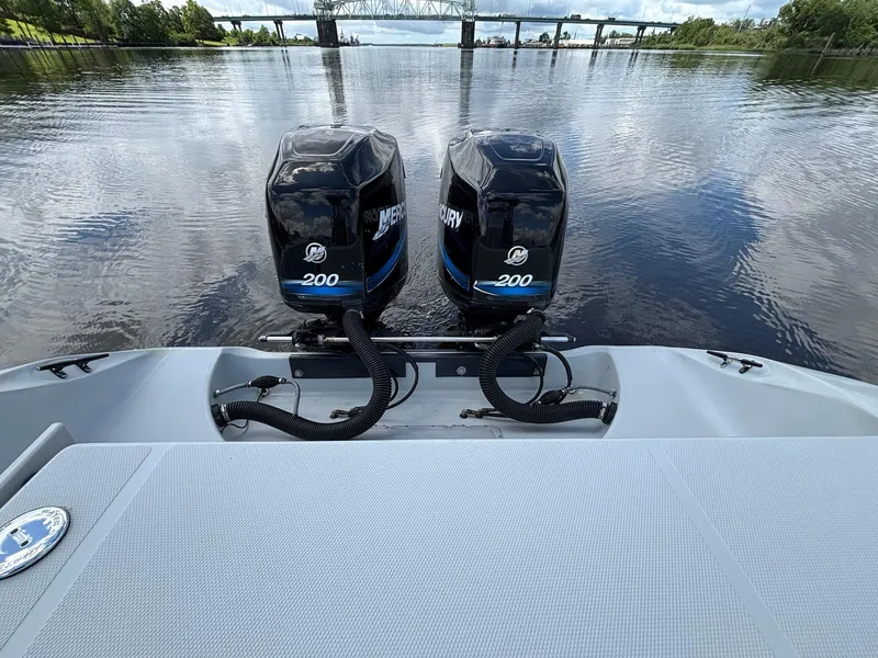 Slide: The Image of 2004 Baja 250 Sportfish with twin Mercury 200 engines on a calm river. - 14