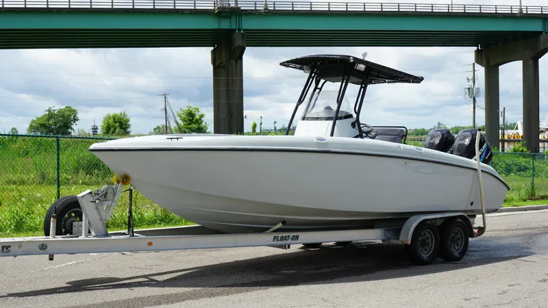 Slide: The Image of 2004 Baja 250 Sportfish boat on trailer under bridge, ready for transport. - 15