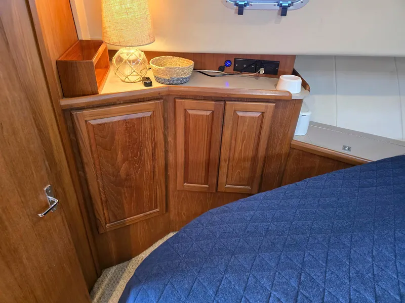 Slide: The Image of Interior of 1997 Mainship 350 Trawler with cozy seating and waterfront view. - 21