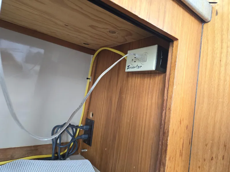 Slide: The Image of 1997 Mainship 350 Trawler cabin with cozy bed and soft lighting. - 28