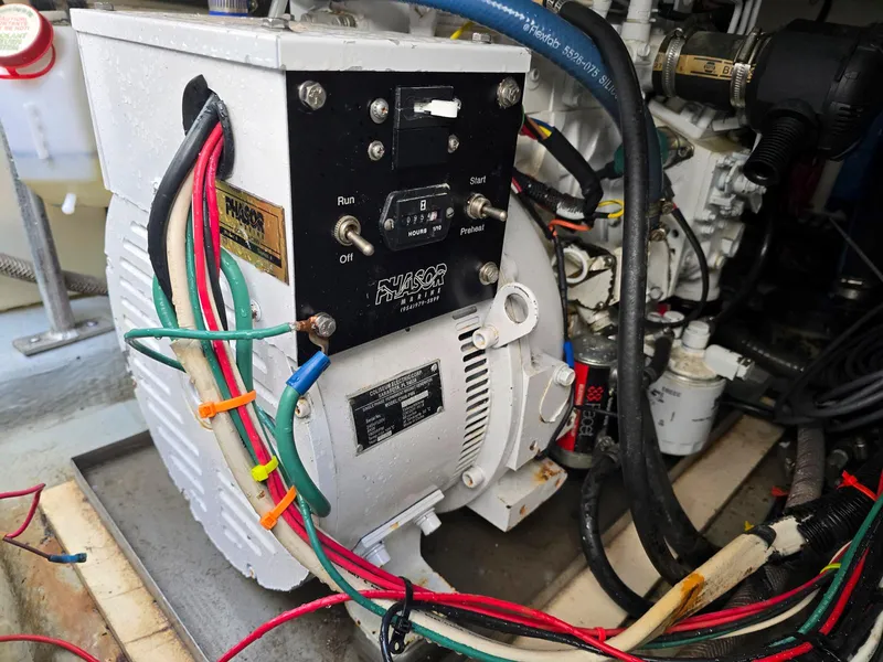 Slide: The Image of Caterpillar engine in a 1997 Mainship 350 Trawler, yellow and industrial. - 32