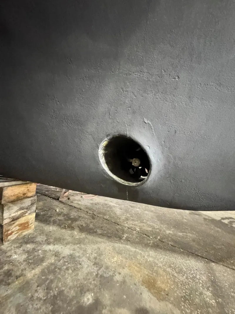 Slide: The Image of 1997 Mainship 350 Trawler hull with visible thruster opening. - 39