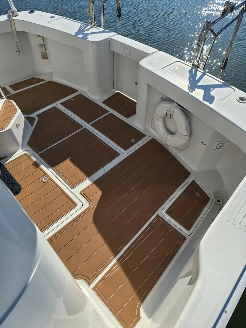 Slide: The Image of 1997 Mainship 350 Trawler in a marina storage facility on a trailer. - 6