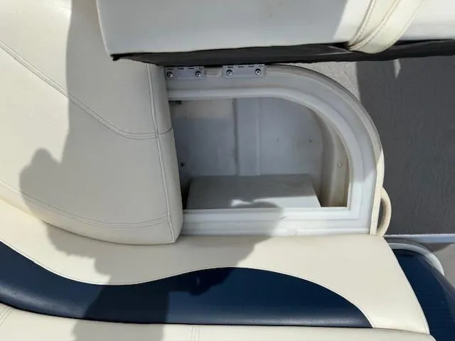 Slide: The Image of Open storage compartment in 2014 Godfrey 22 Aqua Patio boat seat. - 12