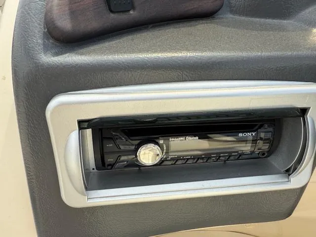 Slide: The Image of Sony stereo system in a 2014 Godfrey 22 Aqua Patio boat dashboard. - 17