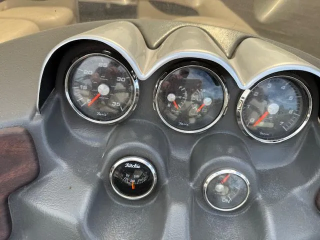 Slide: The Image of Dashboard of 2014 Godfrey 22 Aqua Patio boat with gauges and compass. - 21