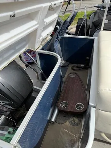 Slide: The Image of 2014 Godfrey 22 Aqua Patio interior with seating and storage compartments. - 22