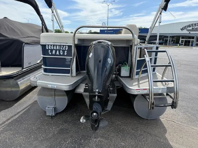 Slide: The Image of 2014 Godfrey 22 Aqua Patio pontoon boat with outboard motor, labeled "Organized Chaos." - 27
