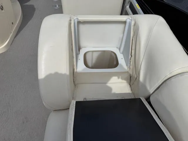 Slide: The Image of 2014 Godfrey 22 Aqua Patio boat seat with built-in cup holder. - 5