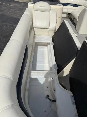 Slide: The Image of 2014 Godfrey 22 Aqua Patio boat interior with open storage compartment. - 8