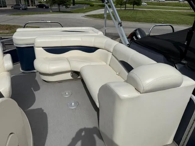 Slide: The Image of 2014 Godfrey 22 Aqua Patio boat with white leather seating and spacious deck. - 9