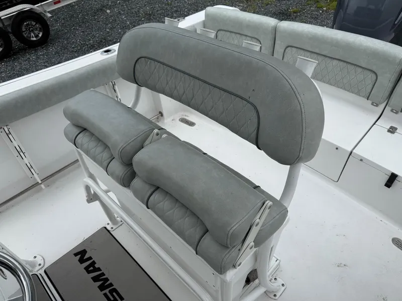 Slide: The Image of 2020 Sportsman Heritage 231 Center Console boat seating, featuring gray cushioned seats. - 10