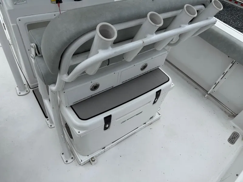 Slide: The Image of 2020 Sportsman Heritage 231 Center Console boat seating with rod holders and storage. - 11